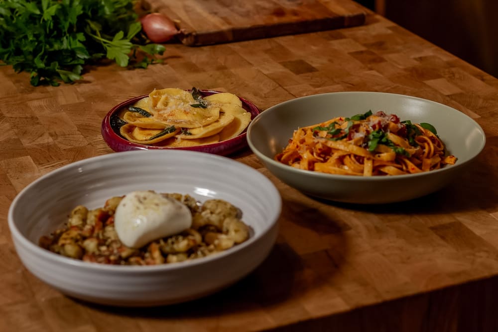 Three plated dishes on the counter